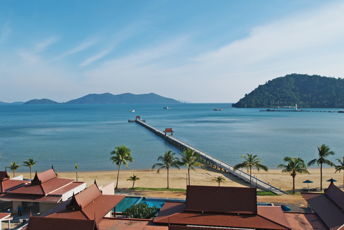 Luxury beachfront penthouse in Koh Chang with freehold ownership, stunning sea views, spacious living area, modern Thai design, high ceilings, private pier, and fully furnished with a large kitchen. Listed with Koh Chang Properties.
