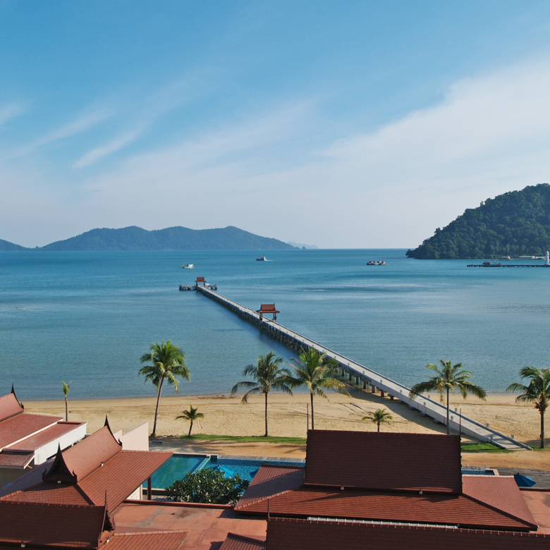 Luxury beachfront penthouse in Koh Chang with freehold ownership, stunning sea views, spacious living area, modern Thai design, high ceilings, private pier, and fully furnished with a large kitchen. Listed with Koh Chang Properties.