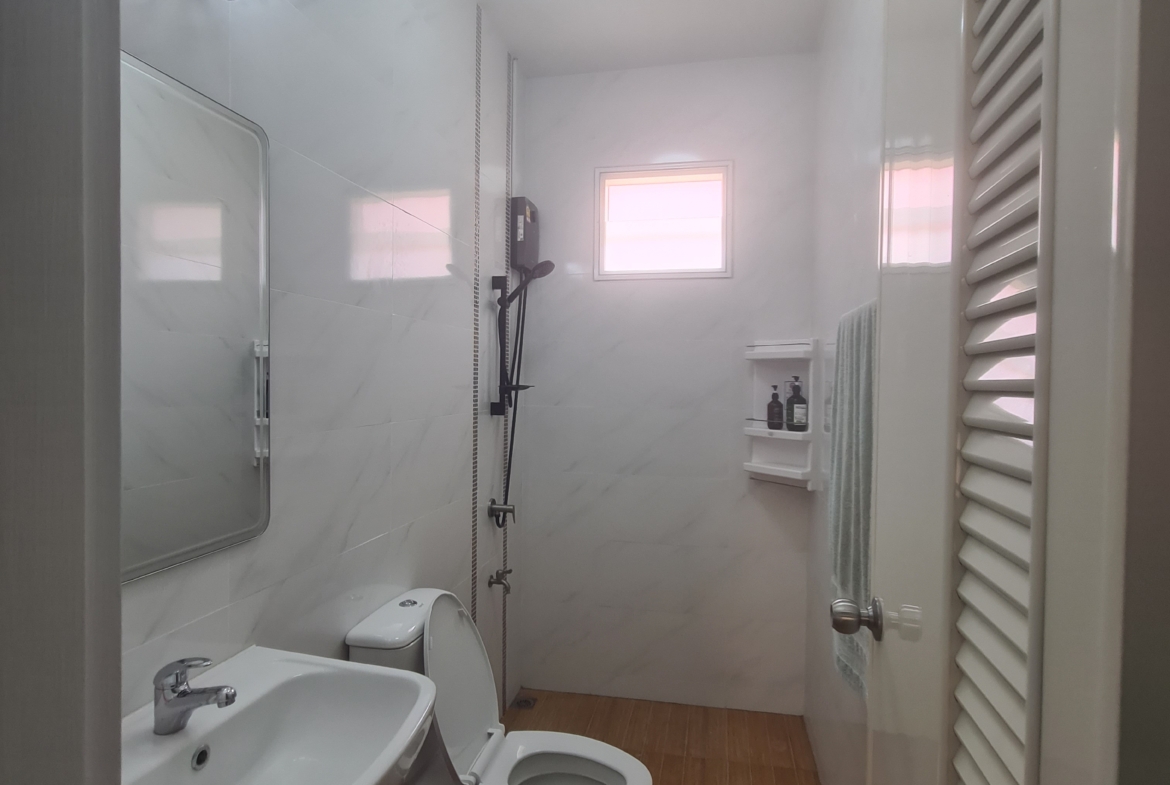 Fully furnished 2-bedroom house for sale in Bang Saray with mountain views, private parking, and easy access to Pattaya and Bangkok.