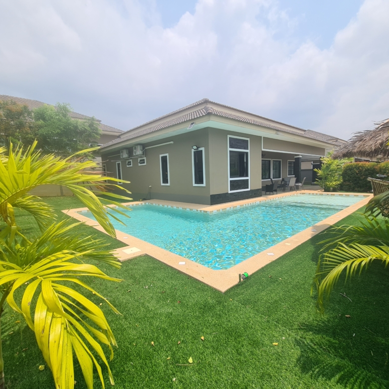 Luxury 5-bedroom pool villa in Bang Saray, Thailand, featuring a private pool, landscaped garden, and modern interiors.