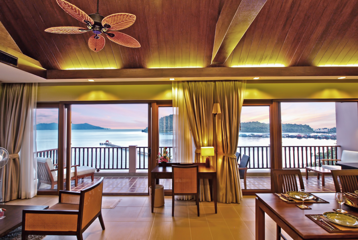Luxury beachfront penthouse in Koh Chang with freehold ownership, stunning sea views, spacious living area, modern Thai design, high ceilings, private pier, and fully furnished with a large kitchen. Listed with Koh Chang Properties.