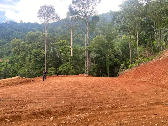 Panoramic sea view land for sale on Koh Chang with mountain elevation, surrounded by lush nature and ideal for luxury villa or resort development.