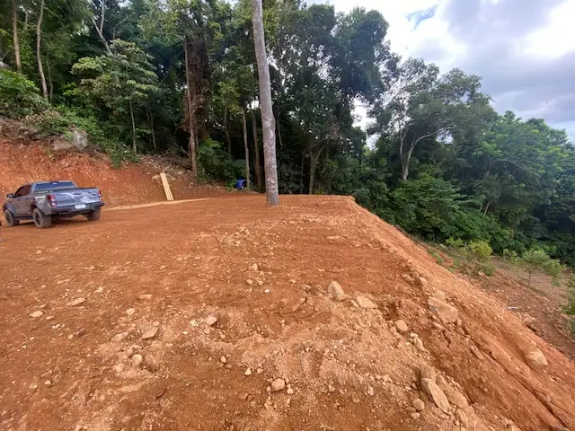 Panoramic sea view land for sale on Koh Chang with mountain elevation, surrounded by lush nature and ideal for luxury villa or resort development.