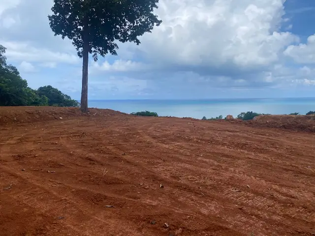 Panoramic sea view land for sale on Koh Chang with mountain elevation, surrounded by lush nature and ideal for luxury villa or resort development.